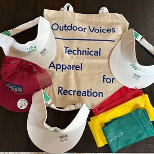 NWT Outdoor Voices canvas bag w/ 3 white visors, red golf hat, and 3 Therabands.